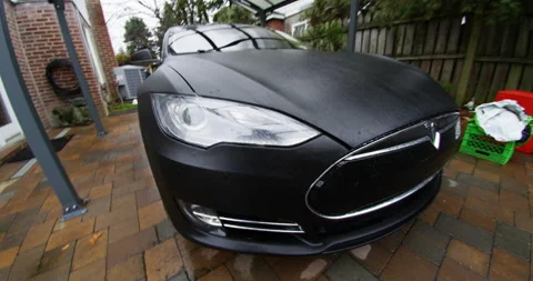 4k Tesla Model S side front shot in driveway Stock Footage 137622289