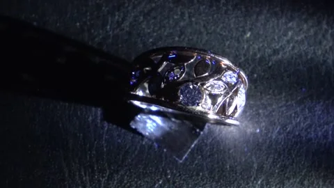 4K Testing Diamond Fluorescence: White Light vs. UV Flashlight Stock Footage 281315817