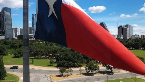 4K Texas Flag Blowing in Wind Aerial Austin Video stock 116263498