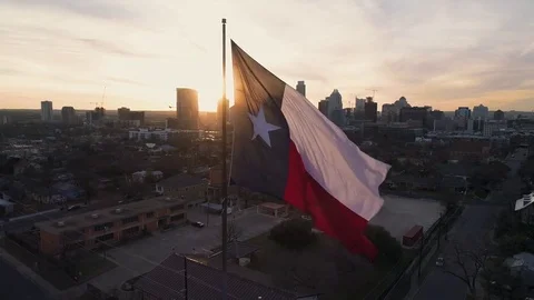 4K Texas Flag Orbit Aerial at Sunset - Austin Stock Footage