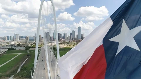 4K Texas Flag Slow Motion with Dallas Skyline In Background Aerial Stock Footage 95825006