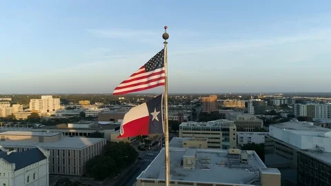 4K Texas Flag US Flag Aerial at Sunset Stock Footage 97864160