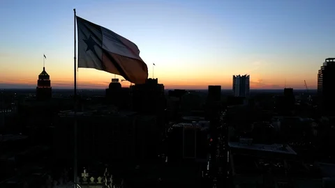 4K Texas Flag Waving Over San Antonio Drone Sunset Stock Footage 119752976