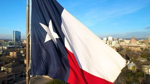 4K Texas Landscape with Texas State Flag Flying Aerial City Morning Stock Footage 124077313