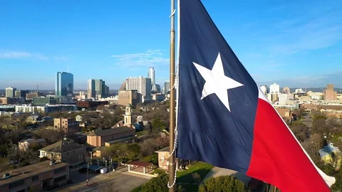 4K Texas State Flag with Downtown Austin Texas in Background Aerial Footage Stock Footage 124078167