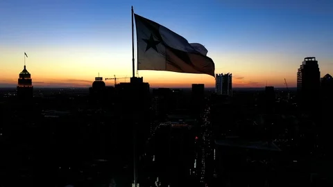 4K Texas State Flag Waving Over San Antonio Texas Drone Aerial Stock Footage 119753633