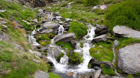4K. Thawing stream of the summits of Sierra Nevada in Granada Stock Footage 76976487
