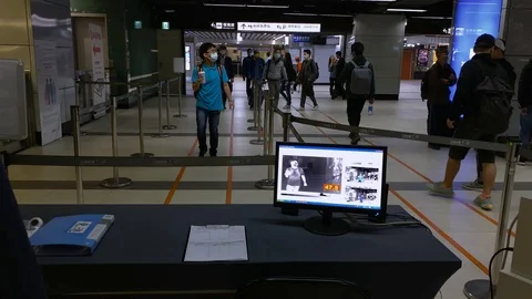 4K Thermal scanner detecting infected people with Covid-19 in train station.-Dan Stock Footage 126723250