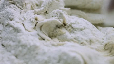 4K Thick Gingerbread Dough Beginning to Form in a Glass Bowl Stock Footage 342113169