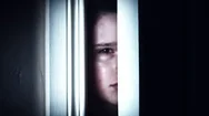 4K Thriller Child Eye Looking Through Door Hole Gap And Crying Stock Footage