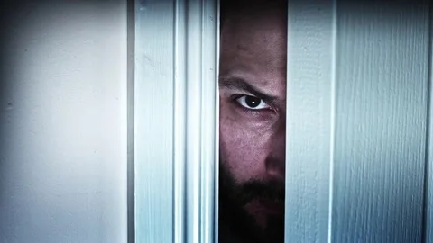 4K Thriller Man Eye Looking in Door Gap, dolly fast Video stock 70053610