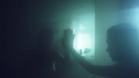 4k Thriller Shot of a Woman in Bath Room Wiping the Mirror Stock Footage