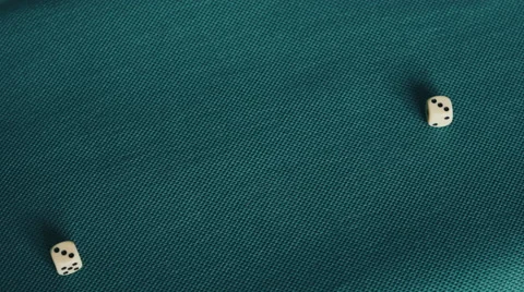 4K throwing white dice on blue/green table rolling two threes Stock Footage 50381018