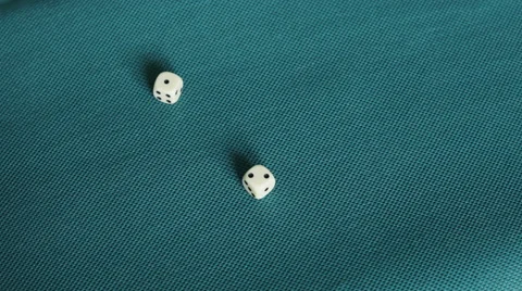 4K throwing white dice on blue/green table rolling one and two Stock Footage 50401435