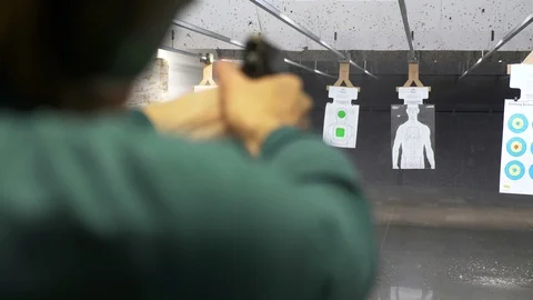 4K Tight Over The Shoulder View Of Man Shooting Down Range At Target Stock-Footage 106125483