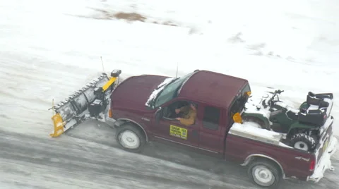 4K tight overhead shot of pick up truck plowing snow Stock Footage 47008141