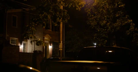 4K TILT DOWN OF BEAUTIFUL SUBURBAN HOUSE BY STREET LAMP UNDER MOON Stock Footage