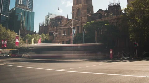 A 4k tilt down as clouds roll over people and traffic at Sydney Town Hall Stock Footage 47131611