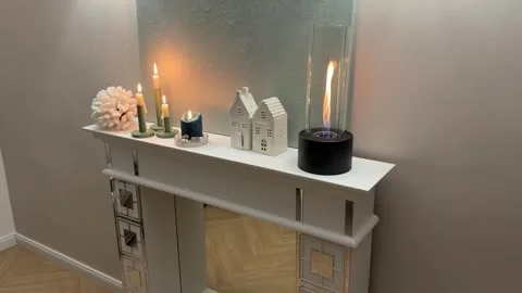 4K - Tilt Down Reveal Of White Fireplace Mantel With Mirror Details At Night Stock Footage 345364939