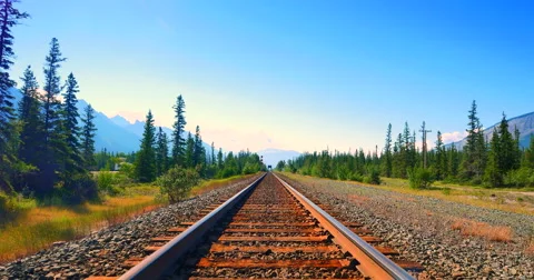 4K Tilt Down Shot, Blue Sky and Train Tracks Leading to Horizon Stock Footage 58142588