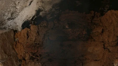 4K tilt down shot that A flame is coming out of a porcelain kiln brick. Stock Footage 76486456