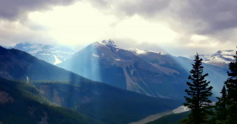 4K Tilt Down View of Mountain Scape, Bright Sun Rays Stock Footage 47117143