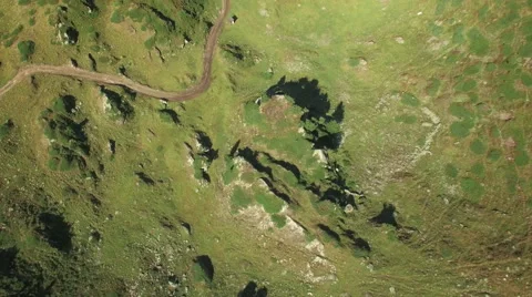 4K tilted down aerial shot of the ground on a mountain Stock Footage 53835325