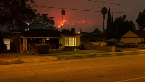 4K time lapse of the 2020 Bobcat Fire burning above Monrovia, California houses Stock Footage 139064748