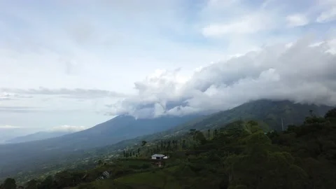 4K time lapse of Agung mount at daylight. Fluffy clouds over mountain. Bali Stock Footage 141122397