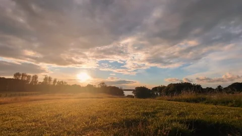 4k time lapse, amazing sunset in green field by the Corrib River, Galway Stock Footage 279105080