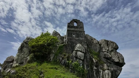4k time-lapse of ancient chapel set in rocks Stock Footage 275607918