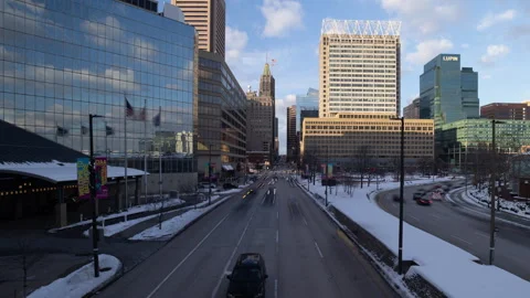 4K Time lapse of approaching car light streaks in snowy Baltimore at sunset Stock Footage 262502435