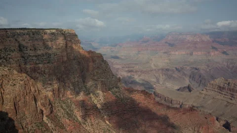 4K time lapse of approaching clouds casting shadows on a Grand Canyon cliff Stock Footage 160228538