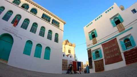 4K Time lapse of an Asilah square with the Al Qamra tower in the background. Stock Footage 92411860