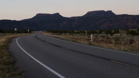 4K Time Lapse of the Bears Ears mesas in Utah and sparse sunset traffic streaks Stock Footage 253240603