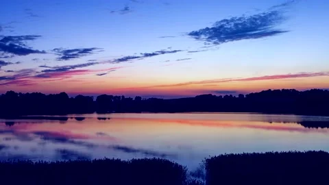 4k time lapse with beautiful after sunset sky over calm lake. Stock Footage 154556961