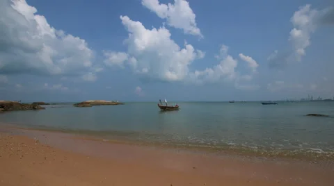 4K Time lapse of beautiful beach scene with fishing boat on the sea Stock Footage 63622864