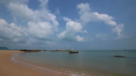 4K Time lapse of beautiful beach scene with fishing boat on the sea Stock Footage 63622888