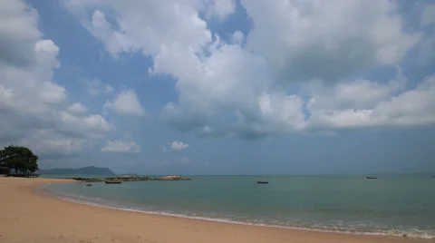 4K Time lapse of beautiful beach scene with fishing boat on the sea Stock Footage 63622935