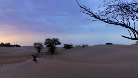 4K Time lapse of beautiful cloud in the desert sand dune at night. Stock Footage 236572913