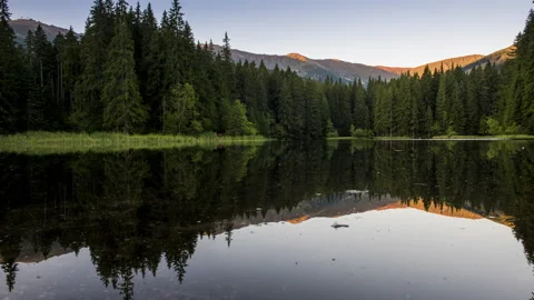 4K Time Lapse of Beautiful landscape with mountains illuminated, reflection i Stock Footage 146762250