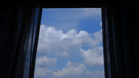 4K Time lapse of blue sky with white clouds, looking from window with curtains Stock Footage 131440984