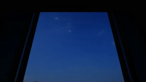 4K Time lapse of blue sky with white clouds, looking from window with curtains Stock Footage 131447682
