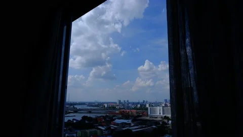 4K Time lapse of blue sky with white clouds, looking from window with curtains Stock Footage 131447959