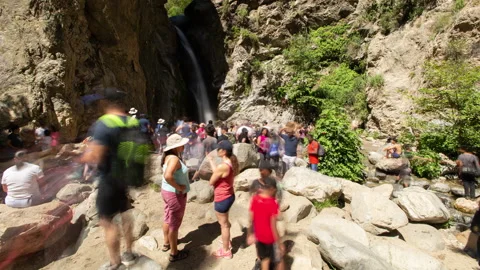 4K Time lapse blurred motion of crowding around Eaton Falls waterfall in summer Stock Footage 147999386