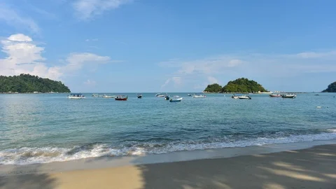 4K time lapse of boats floating on beach with blue sky background Stock Footage 88090935