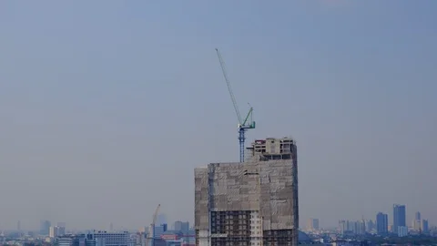 4k. Time Lapse of Building under construction with working crane in Bangkok city Stock Footage 104237084