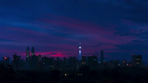 4K time lapse Burning clouds sunrise above Kuala Lumpur skyline Stock Footage 144816130