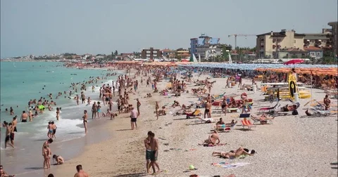 4K time-lapse of a busy beach in August Stock Footage 83951284