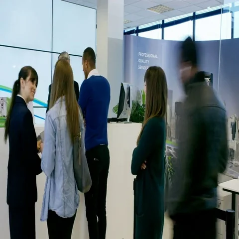 4K Time lapse of busy modern bank, friendly staff assisting customers Stock Footage 69412689